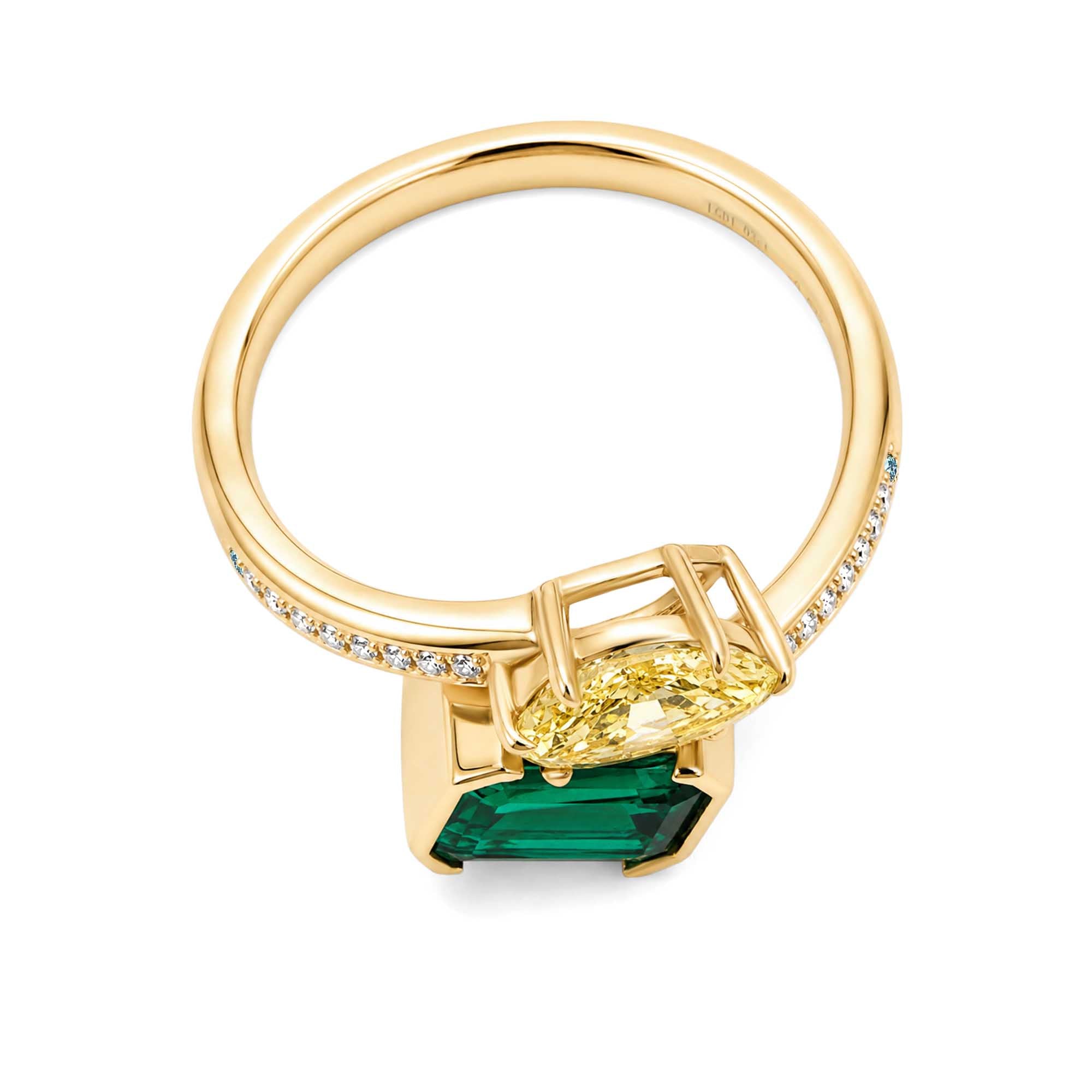 Toi et Moi ring featuring a lab-grown yellow diamond and a lab-grown emerald.