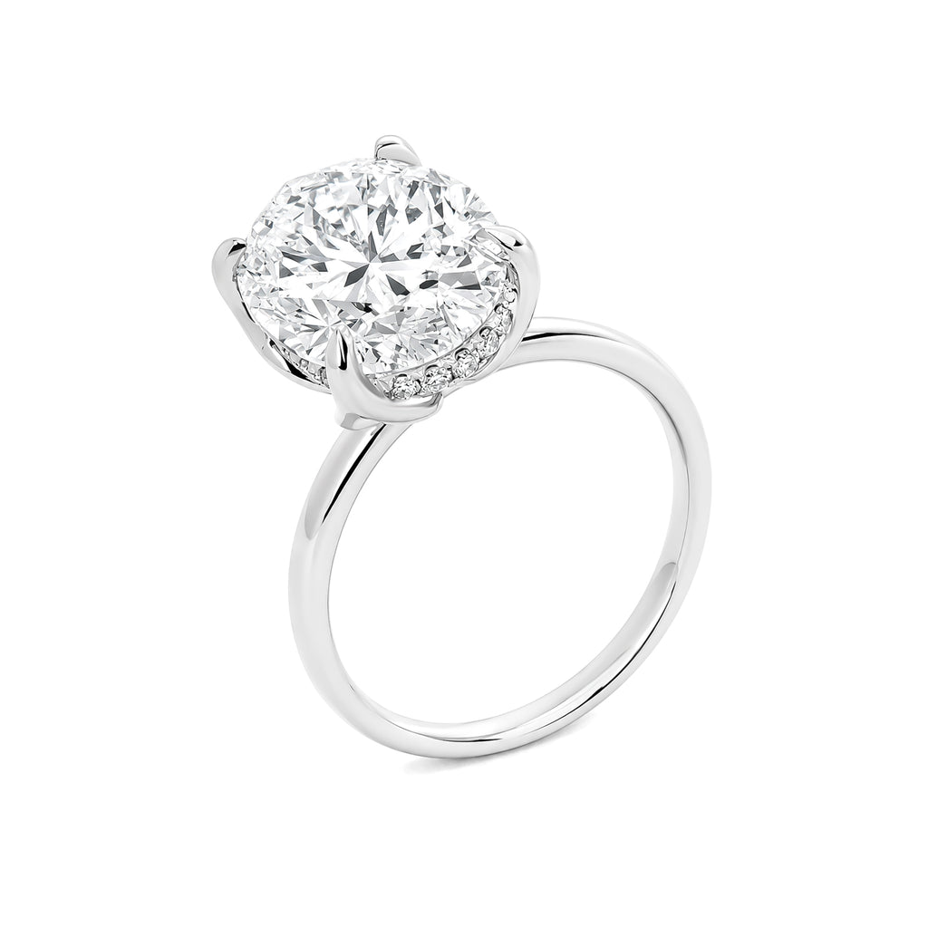 Luxury custom-made 3-carat oval-cut design set in platinum.